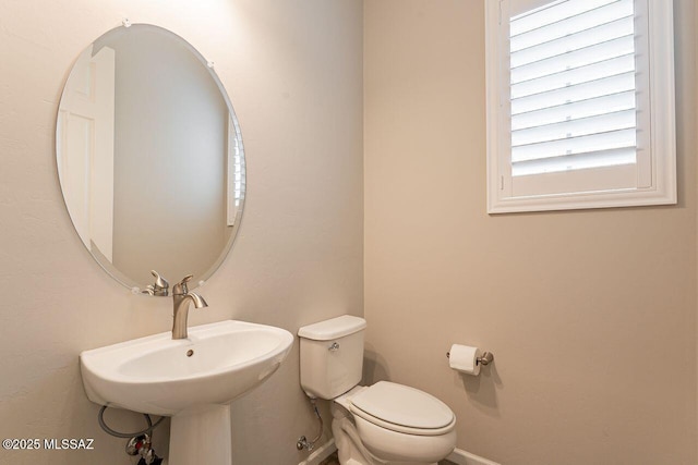 bathroom with sink and toilet