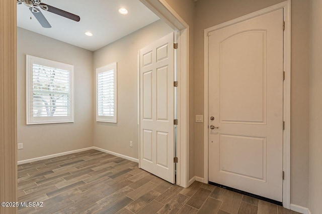 interior space with ceiling fan