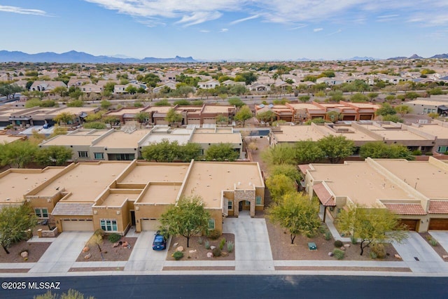 birds eye view of property featuring a mountain view