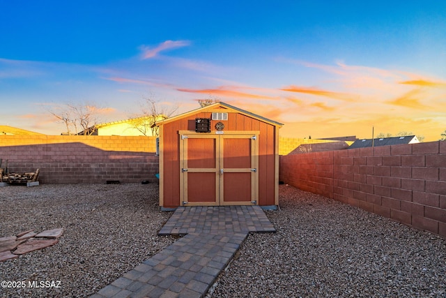 view of outdoor structure at dusk