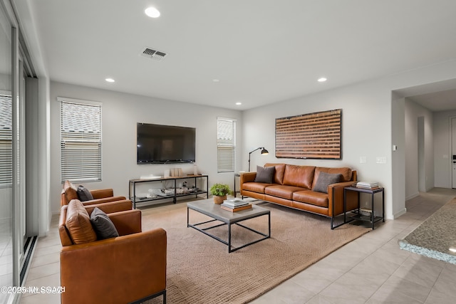 living room with light tile patterned flooring