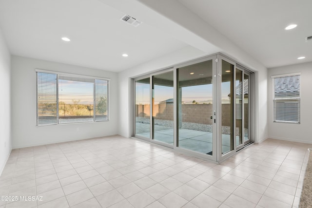 empty room with light tile patterned flooring