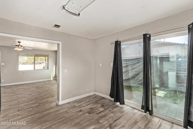 spare room with ceiling fan