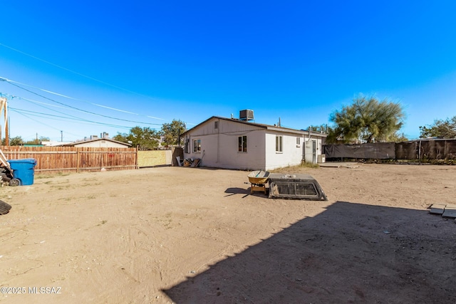 back of property featuring central air condition unit