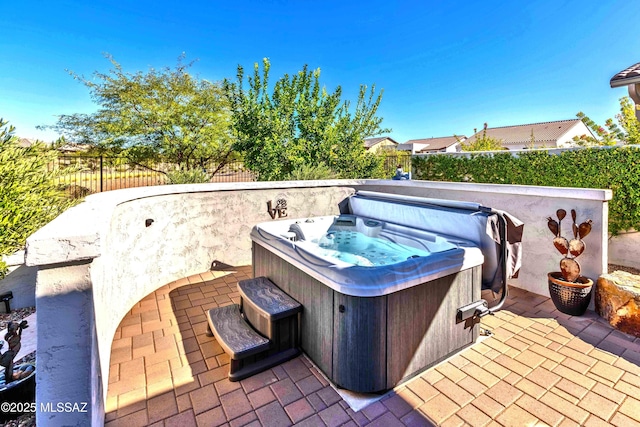 view of patio with a hot tub