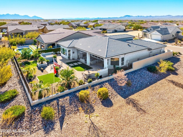 birds eye view of property featuring a mountain view