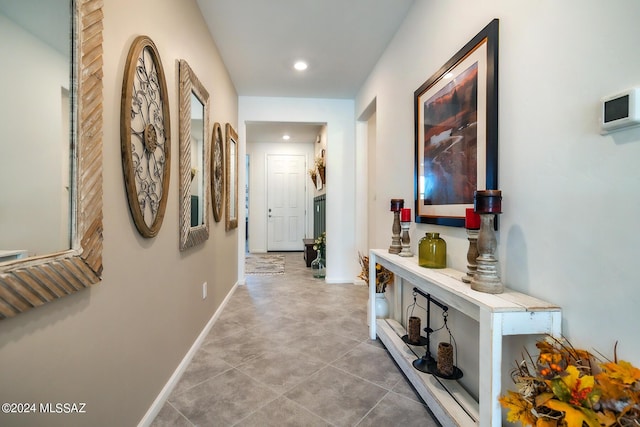 corridor with light tile patterned flooring