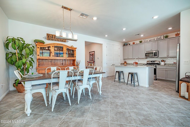 dining space with light tile patterned floors