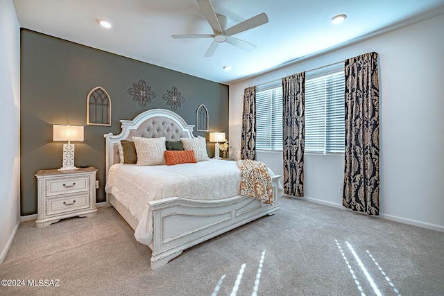 carpeted bedroom featuring ceiling fan