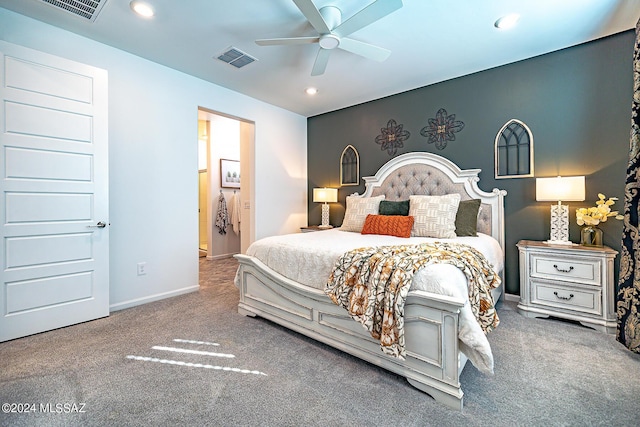 carpeted bedroom featuring ceiling fan and ensuite bathroom