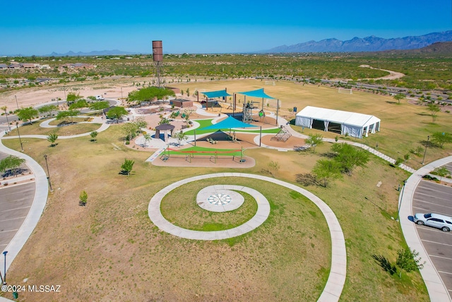 birds eye view of property with a mountain view