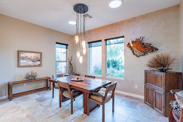 dining room with a healthy amount of sunlight