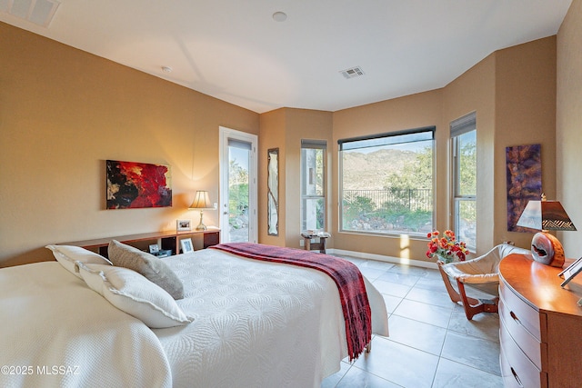 bedroom featuring light tile patterned floors