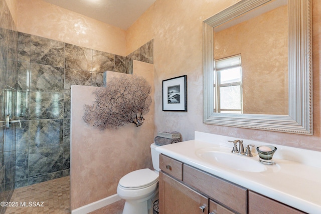 bathroom with vanity, toilet, and walk in shower