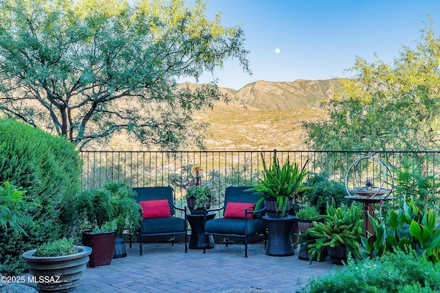 view of patio / terrace with a mountain view