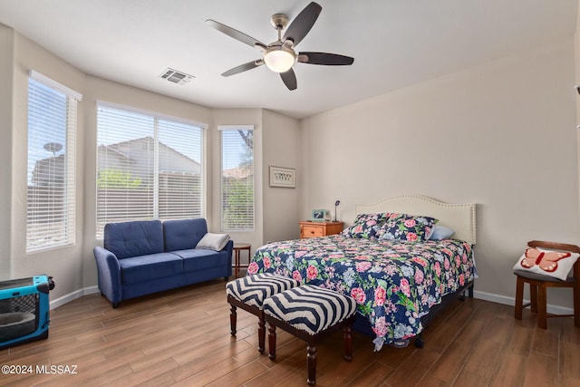 bedroom with ceiling fan and hardwood / wood-style flooring