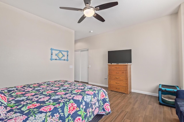 bedroom with light wood-type flooring, a closet, and ceiling fan