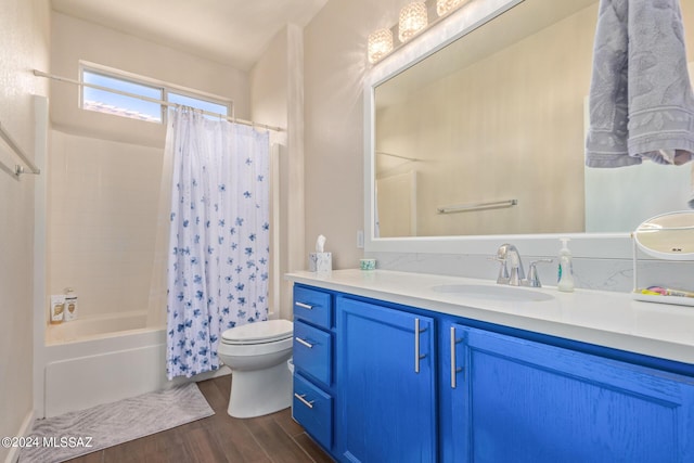 full bathroom featuring hardwood / wood-style floors, vanity, toilet, and shower / tub combo