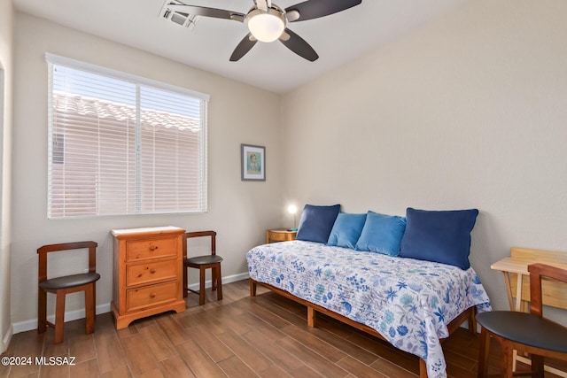 bedroom featuring ceiling fan and dark wood-type flooring