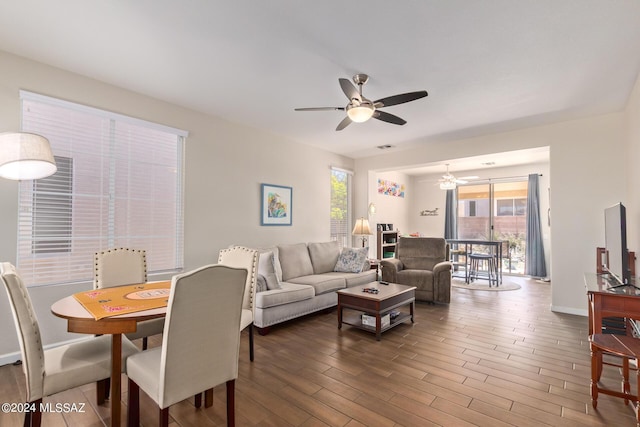 living room with ceiling fan, hardwood / wood-style floors, and plenty of natural light