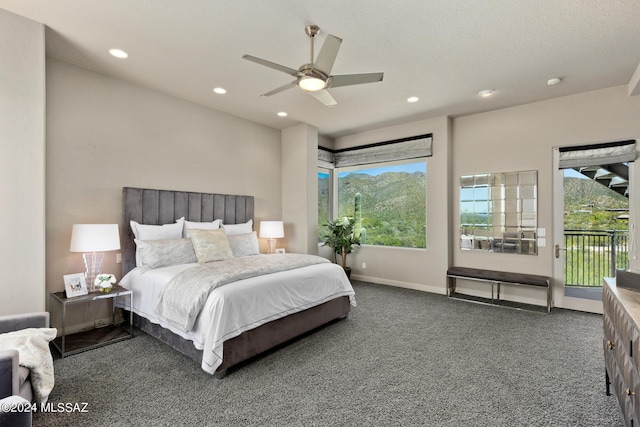 carpeted bedroom featuring access to exterior, ceiling fan, and multiple windows