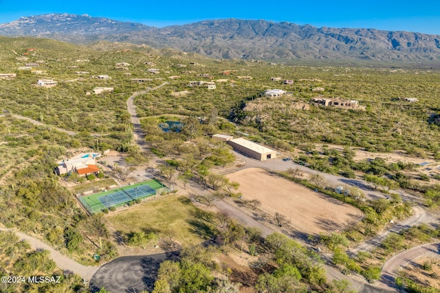 birds eye view of property with a mountain view