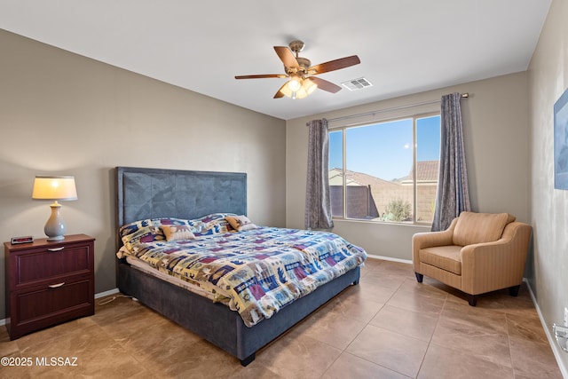 bedroom with ceiling fan, a mountain view, and light tile patterned floors