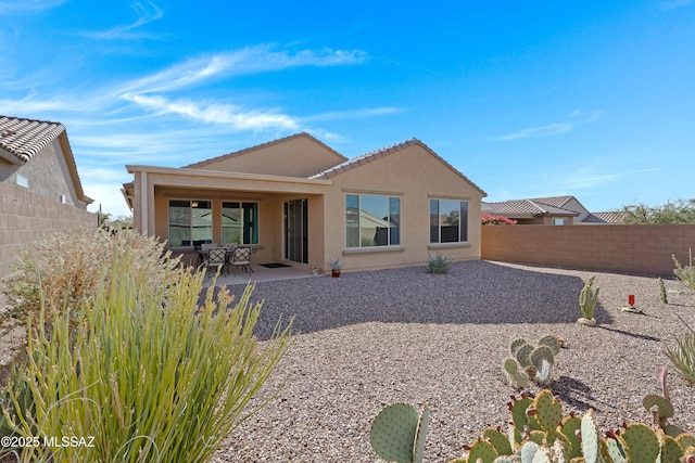 rear view of property with a patio