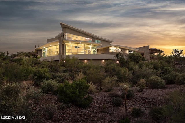 view of property exterior at dusk