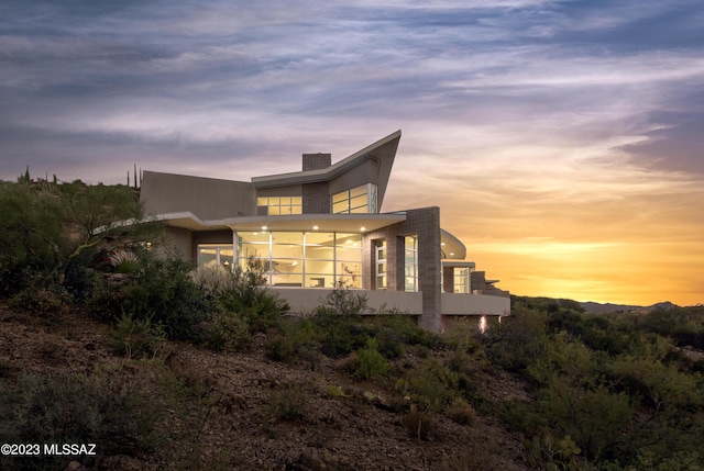 view of property exterior at dusk