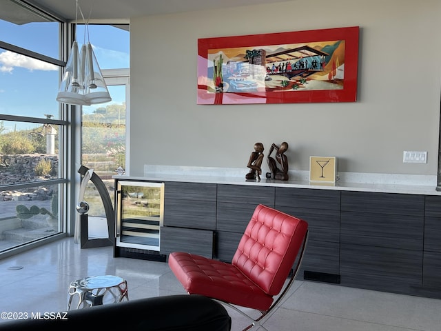 living area featuring floor to ceiling windows