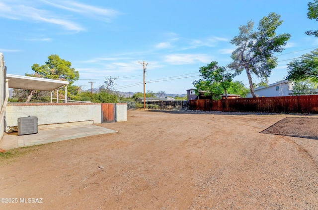 view of yard with central air condition unit