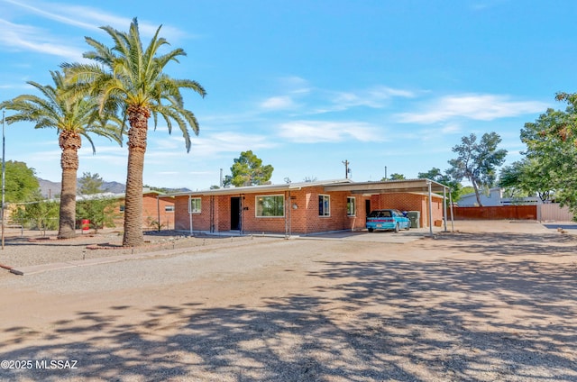 ranch-style home with a carport