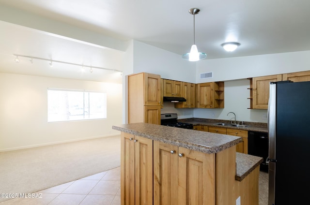 kitchen featuring a center island, sink, appliances with stainless steel finishes, decorative light fixtures, and light colored carpet