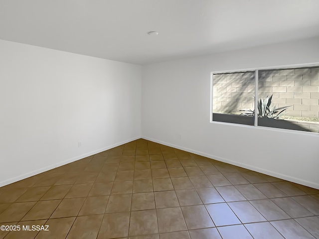 unfurnished room featuring tile patterned floors