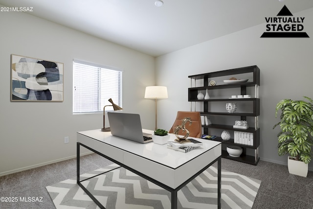 carpeted home office with baseboards