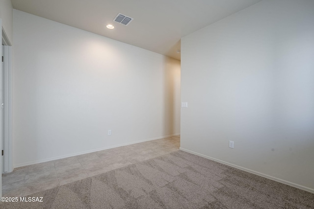 unfurnished room featuring recessed lighting, visible vents, baseboards, and light colored carpet