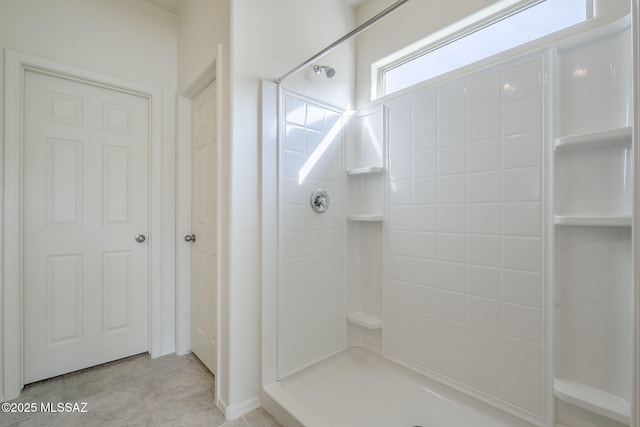 full bathroom with tile patterned flooring and walk in shower