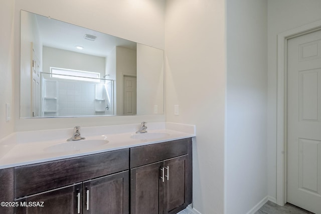 full bathroom featuring a sink, visible vents, a shower, and double vanity