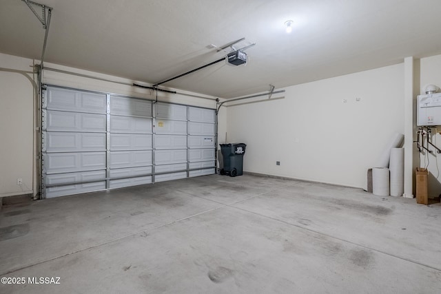 garage featuring tankless water heater and a garage door opener