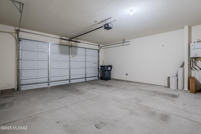 garage featuring a garage door opener and tankless water heater
