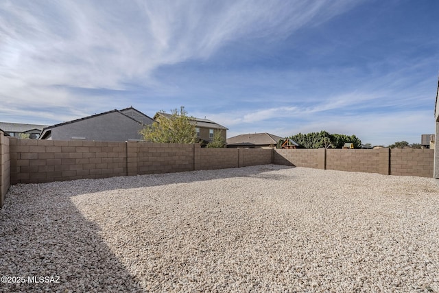 view of yard with a fenced backyard