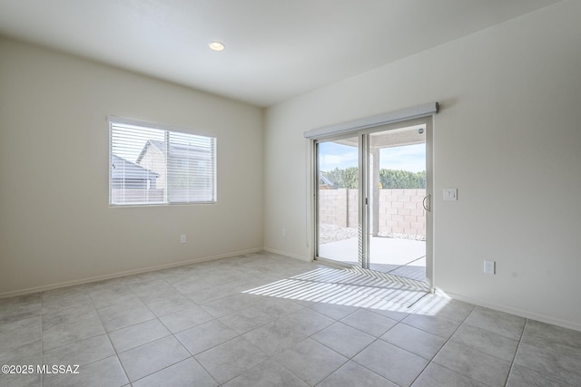 spare room with light tile patterned floors