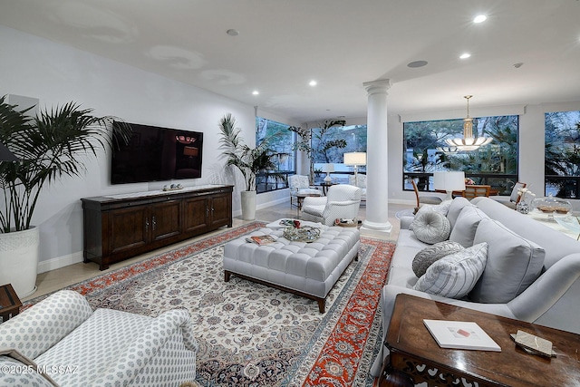 living room with a healthy amount of sunlight and ornate columns