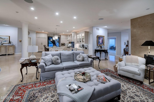 living room with decorative columns