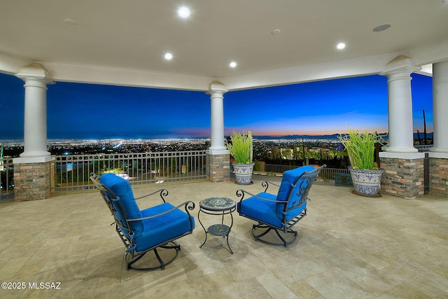 view of patio terrace at dusk