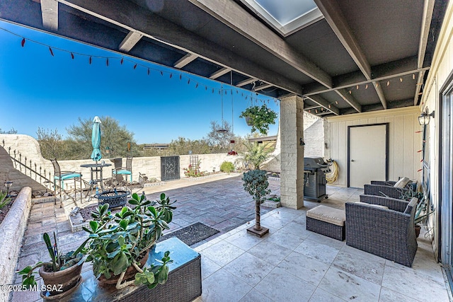 view of patio featuring grilling area and a fenced backyard