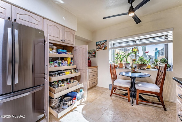 kitchen with open shelves, a ceiling fan, and freestanding refrigerator