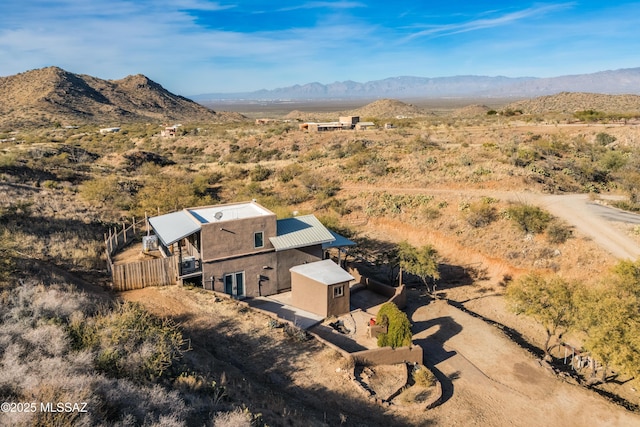 birds eye view of property with a mountain view