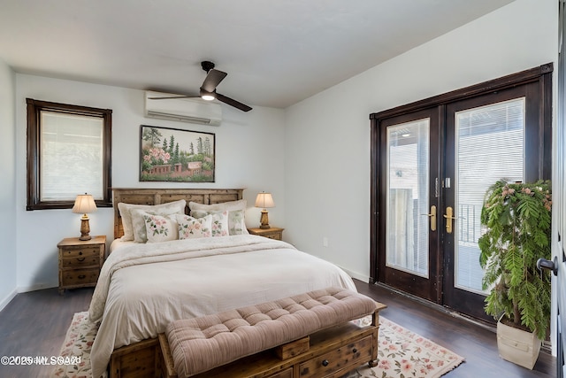 bedroom featuring baseboards, an AC wall unit, access to outside, french doors, and dark wood-style floors